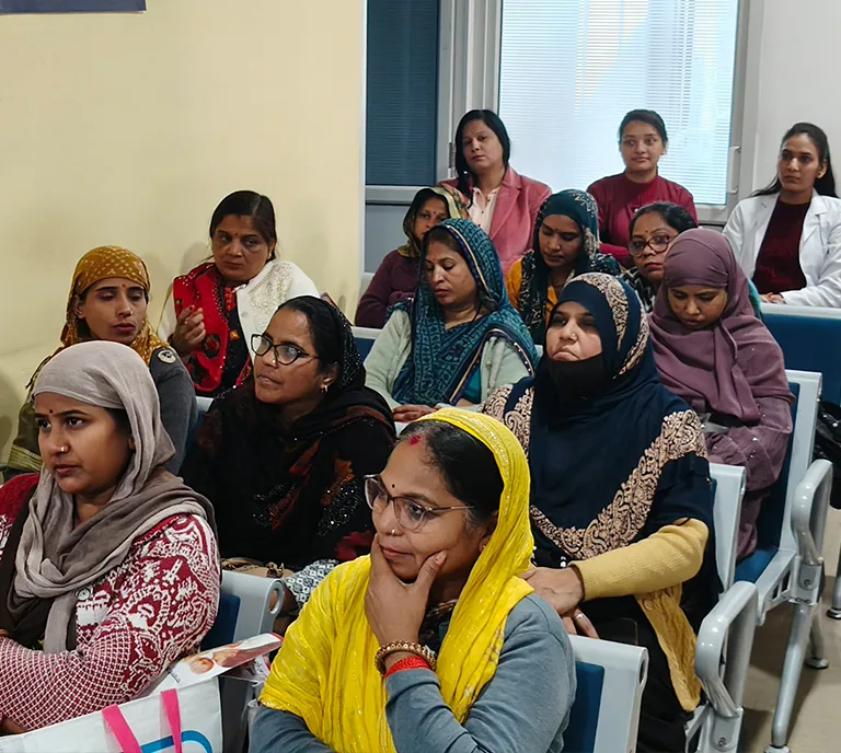 ASHA Workers listening to presentation